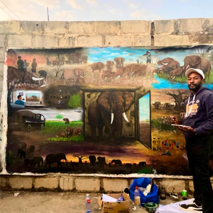 Artist working on the painting